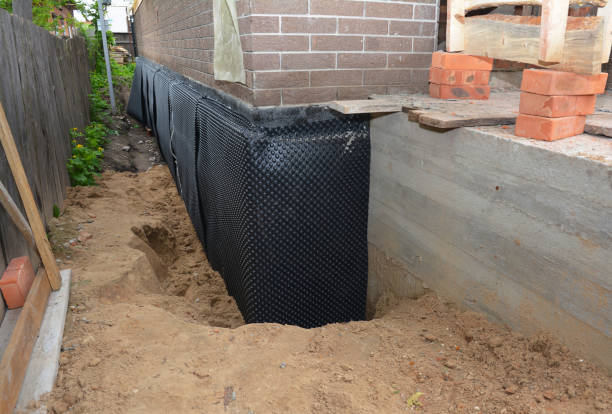 SJ Waterproofing Pros technician performing targeted Sump Pump Installation assessment in Norcross, GA